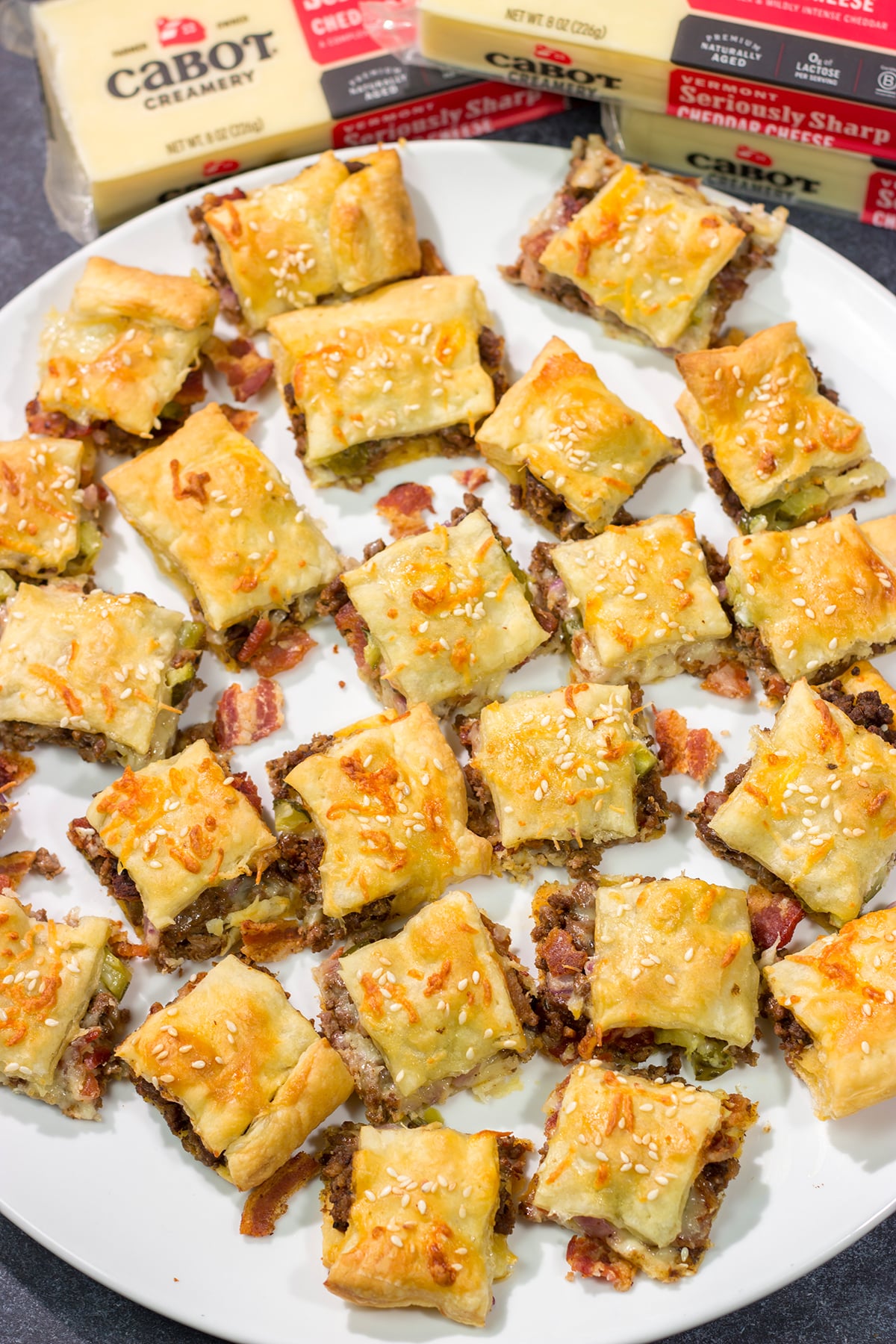 Sandwiched between two layers of puff pastry, these tasty Bacon Cheeseburger Bites are the perfect party appetizer!