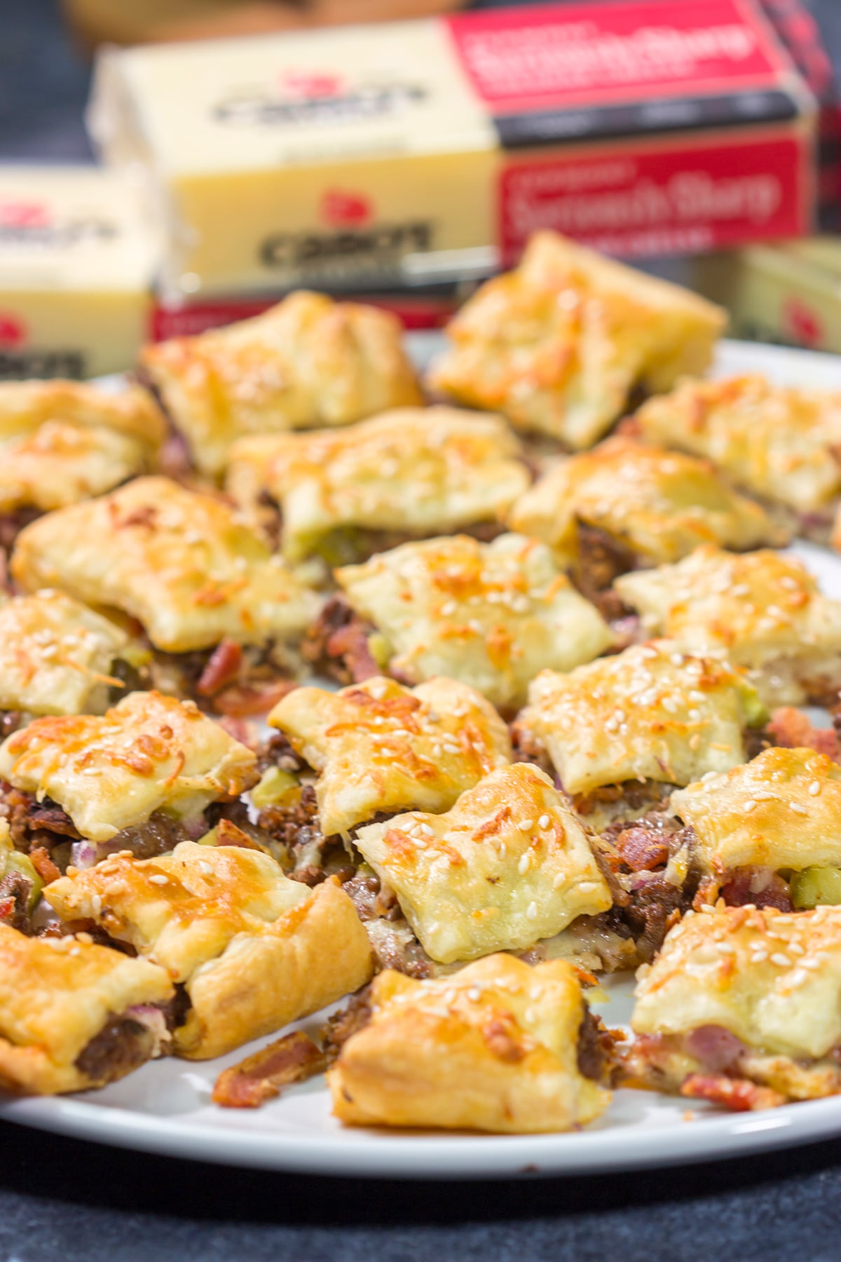 Sandwiched between two layers of puff pastry, these tasty Bacon Cheeseburger Bites are the perfect party appetizer!
