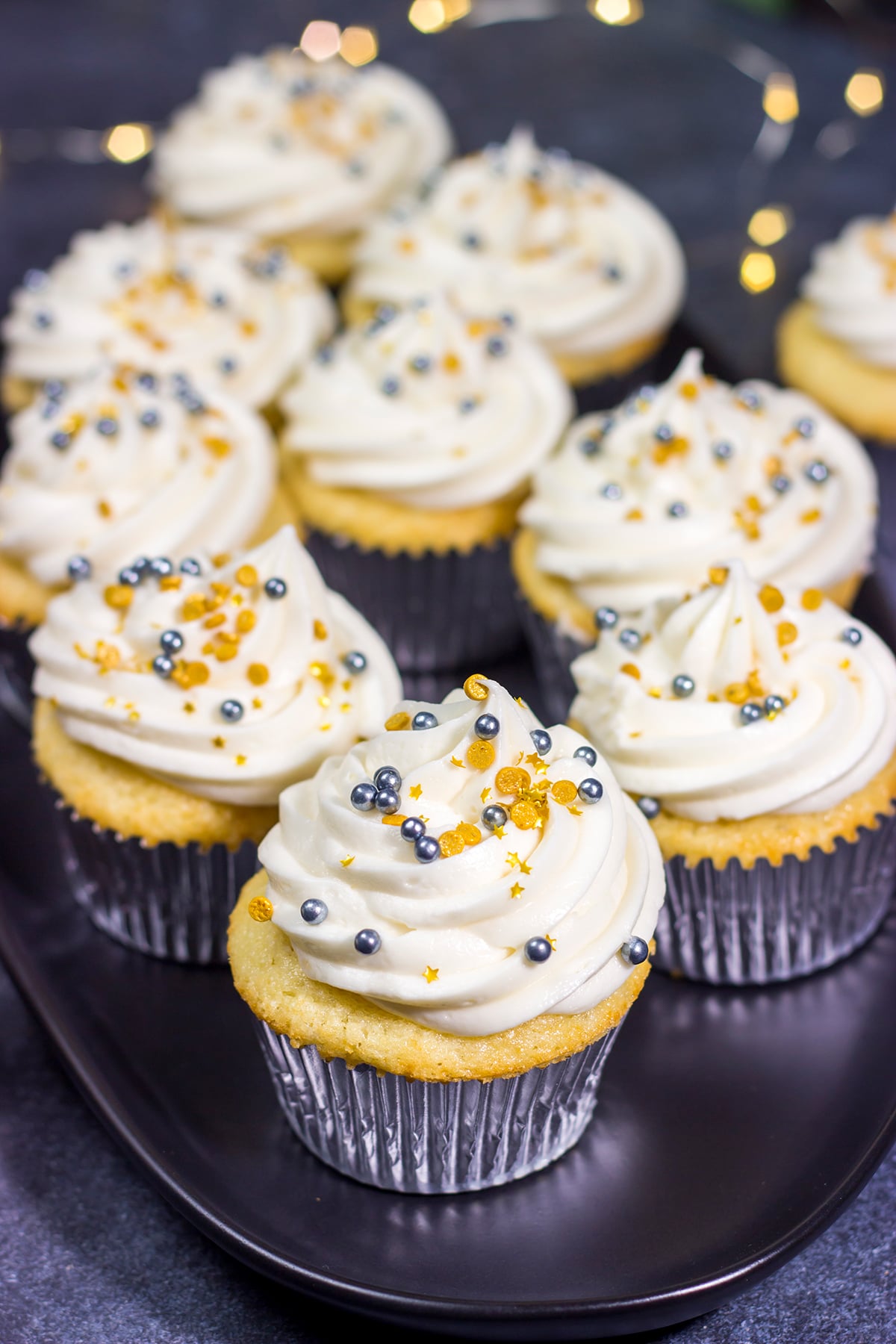 These Champagne Cupcakes feature tender vanilla cupcakes topped with creamy champagne buttercream. They're the perfect treat for New Year's Eve...or any other night of the year!