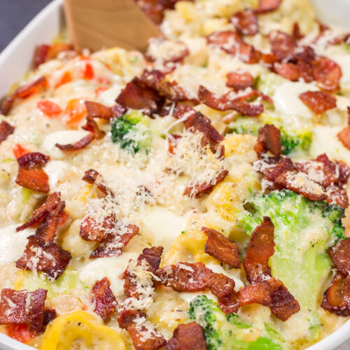 Featuring tender tortellini pasta mixed with a creamy sauce, this Cheesy Tortellini Casserole is the ultimate comfort food recipe!
