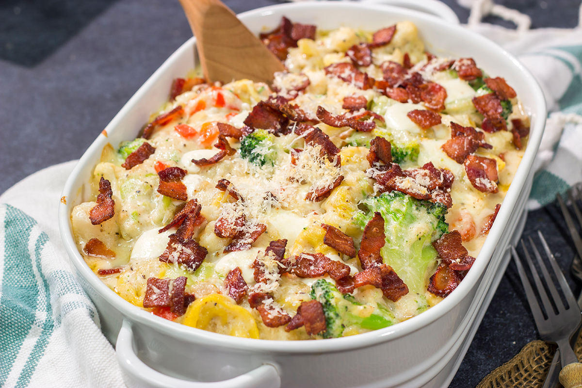 Featuring tender tortellini pasta mixed with a creamy sauce, this Cheesy Tortellini Casserole is the ultimate comfort food recipe!