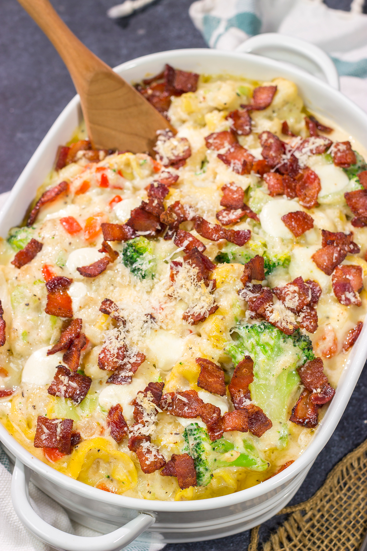 Featuring tender tortellini pasta mixed with a creamy sauce, this Cheesy Tortellini Casserole is the ultimate comfort food recipe!
