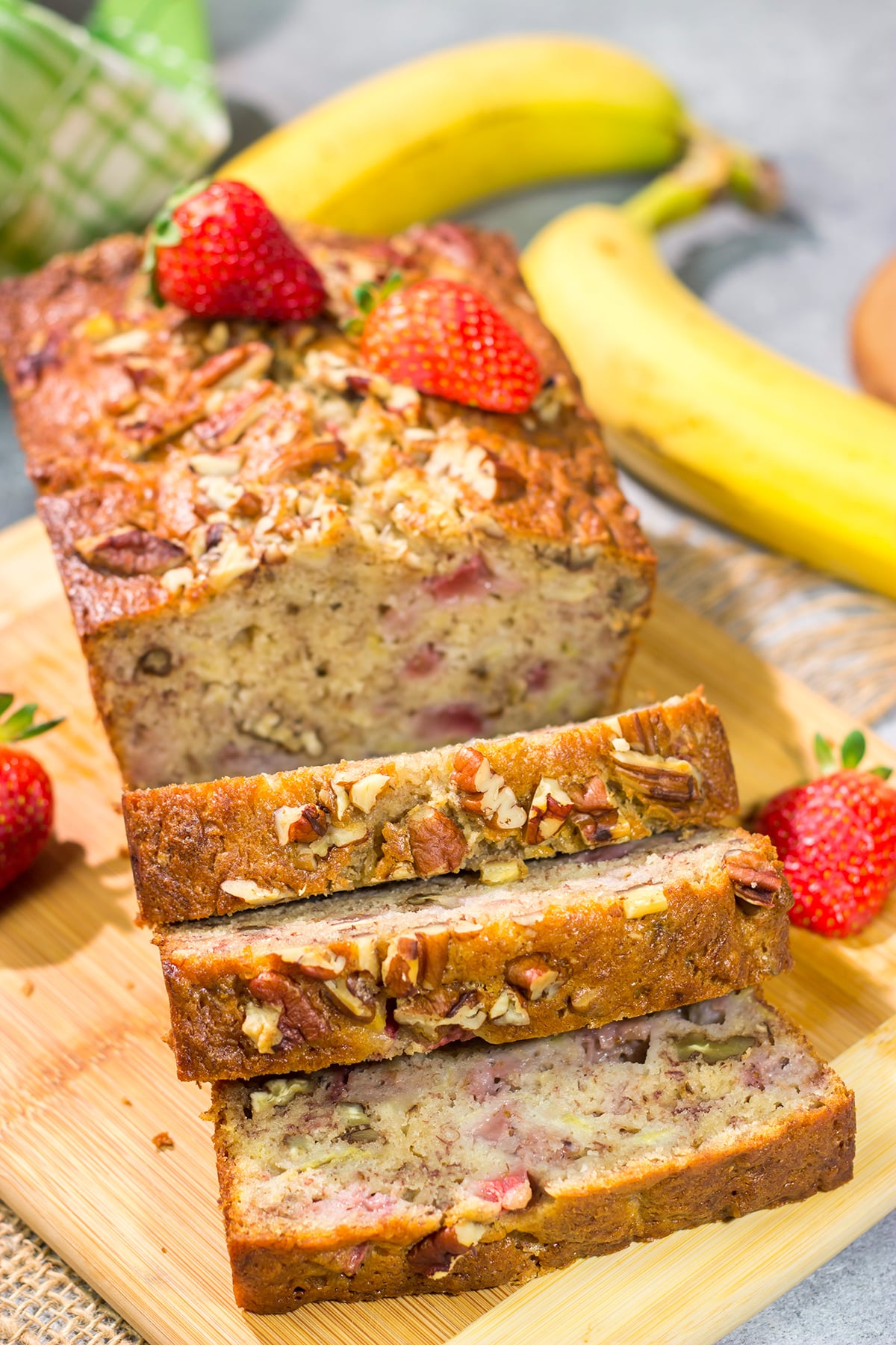 This Strawberry Banana Bread is packed with ripe banana + fresh strawberry flavor. A slice of this bread with a mug of hot coffee is a pretty fantastic way to start the day!