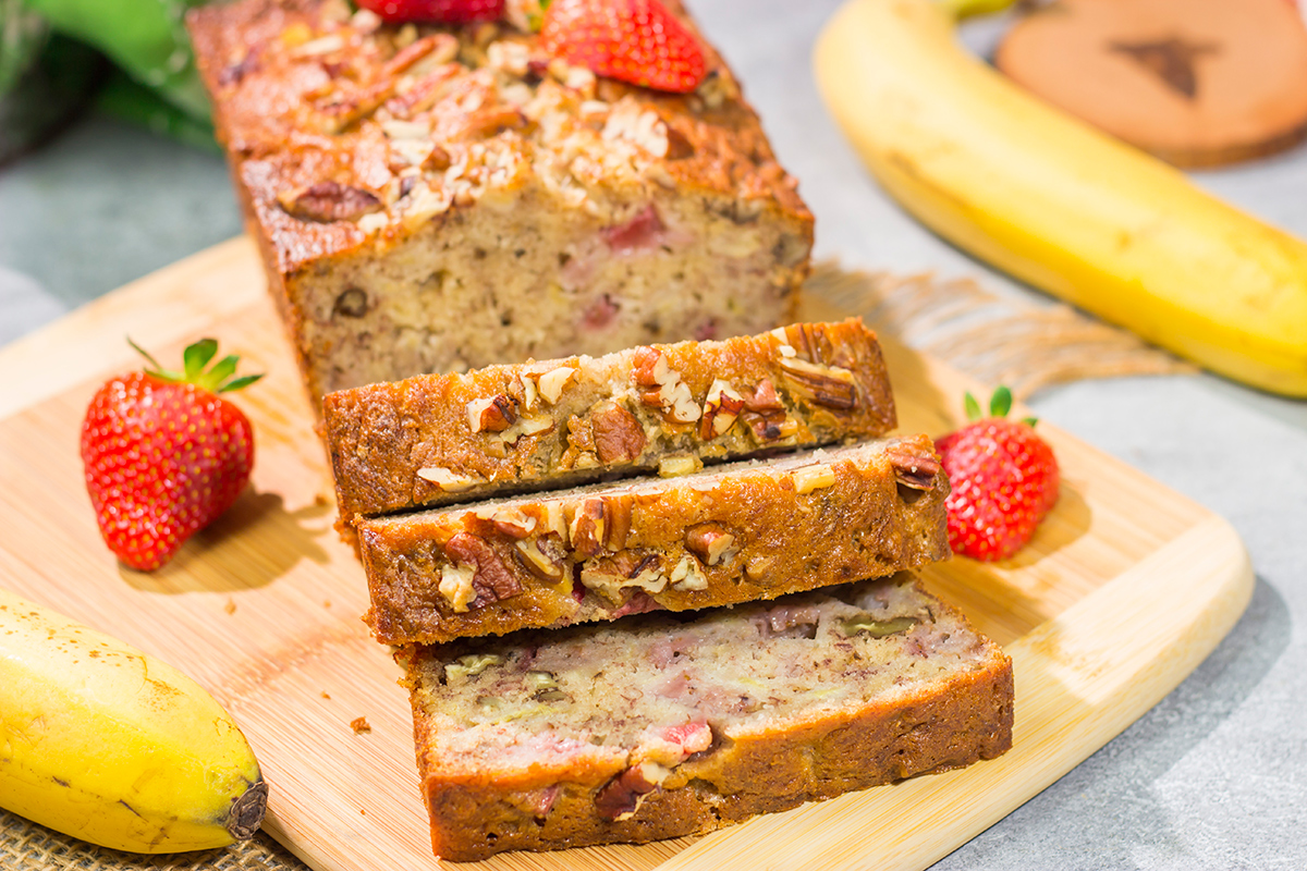This Strawberry Banana Bread is packed with ripe banana + fresh strawberry flavor. A slice of this bread with a mug of hot coffee is a pretty fantastic way to start the day!