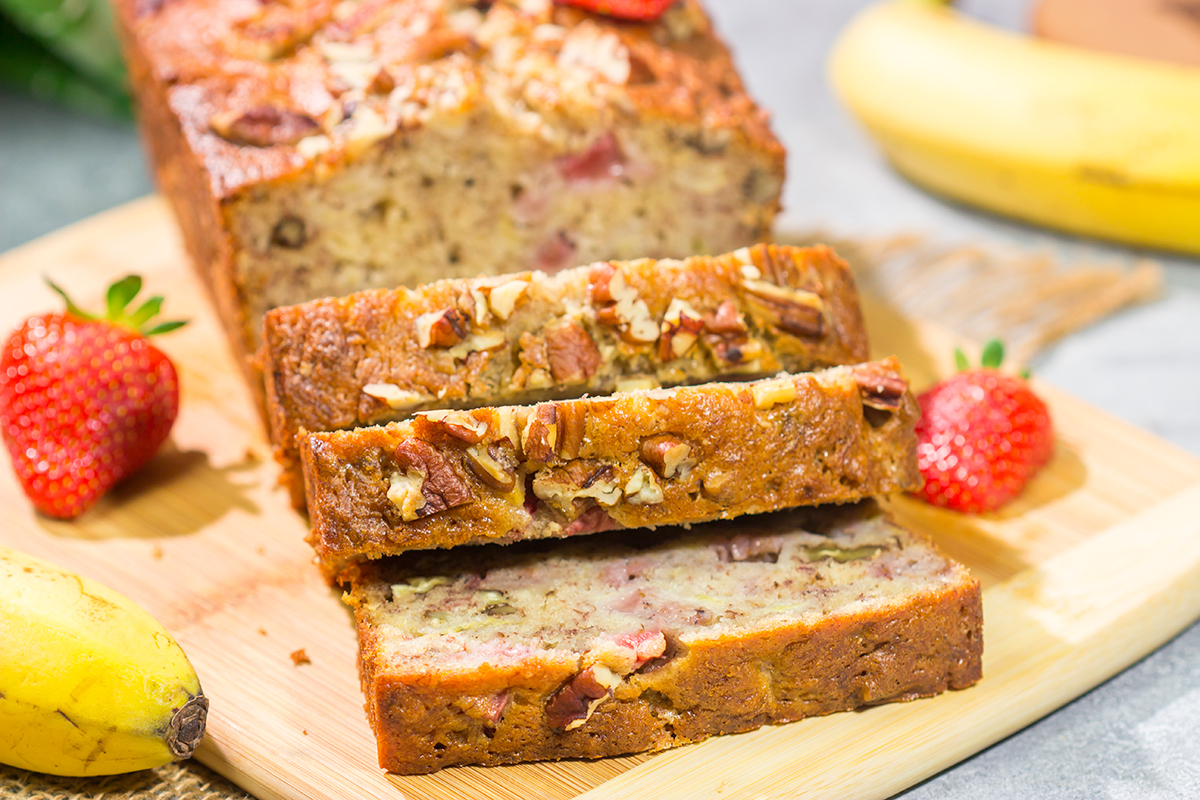 This Strawberry Banana Bread is packed with ripe banana + fresh strawberry flavor. A slice of this bread with a mug of hot coffee is a pretty fantastic way to start the day!