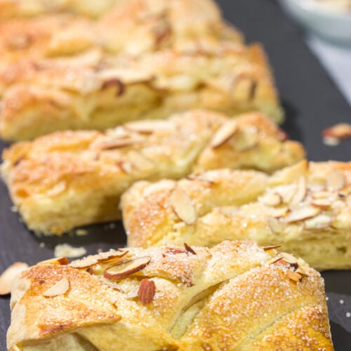 This Almond Puff Pastry recipe features flaky, buttery puff pastry wrapped around homemade almond paste. It's surprisingly easy to make - it'll become a family favorite!