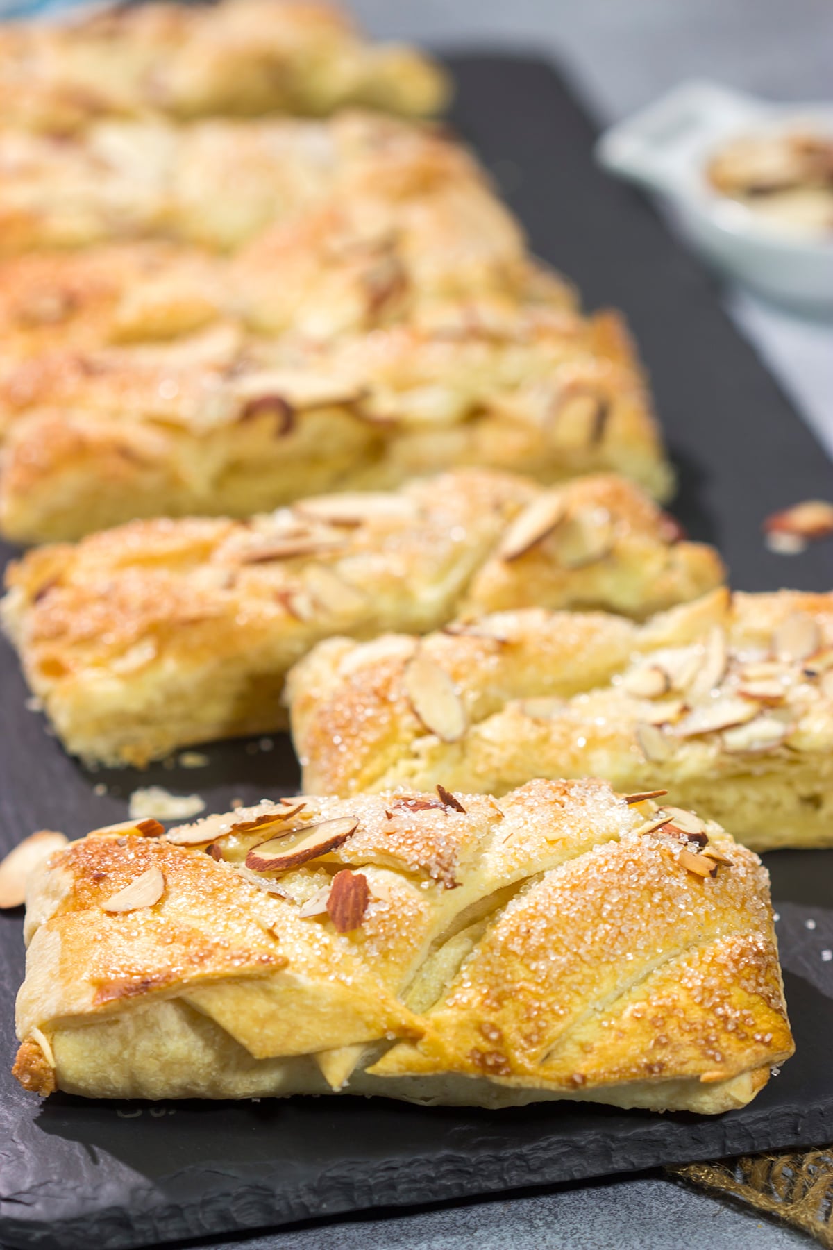 This Almond Puff Pastry recipe features flaky, buttery puff pastry wrapped around homemade almond paste. It's surprisingly easy to make - it'll become a family favorite!
