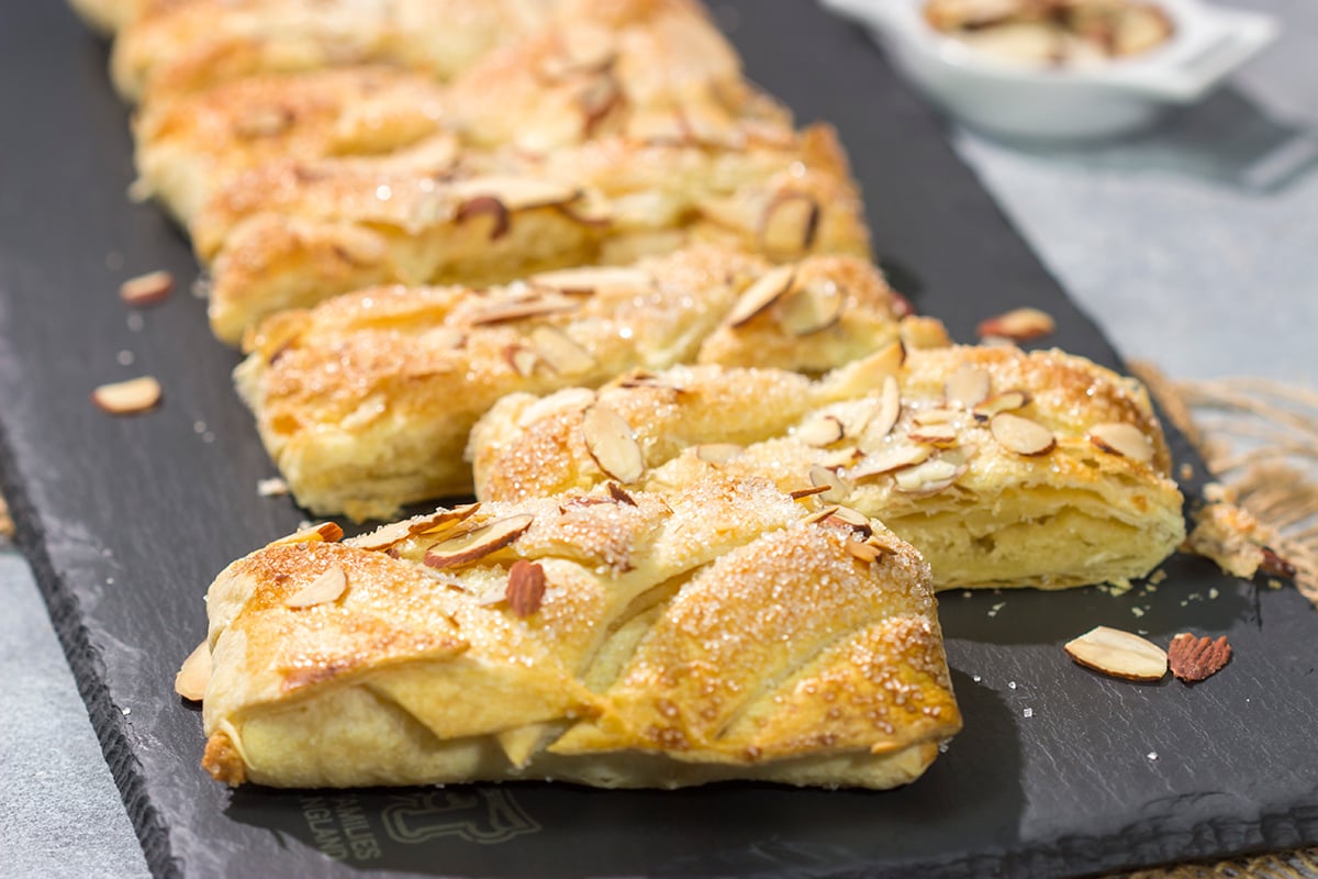 This Almond Puff Pastry recipe features flaky, buttery puff pastry wrapped around homemade almond paste. It's surprisingly easy to make - it'll become a family favorite!