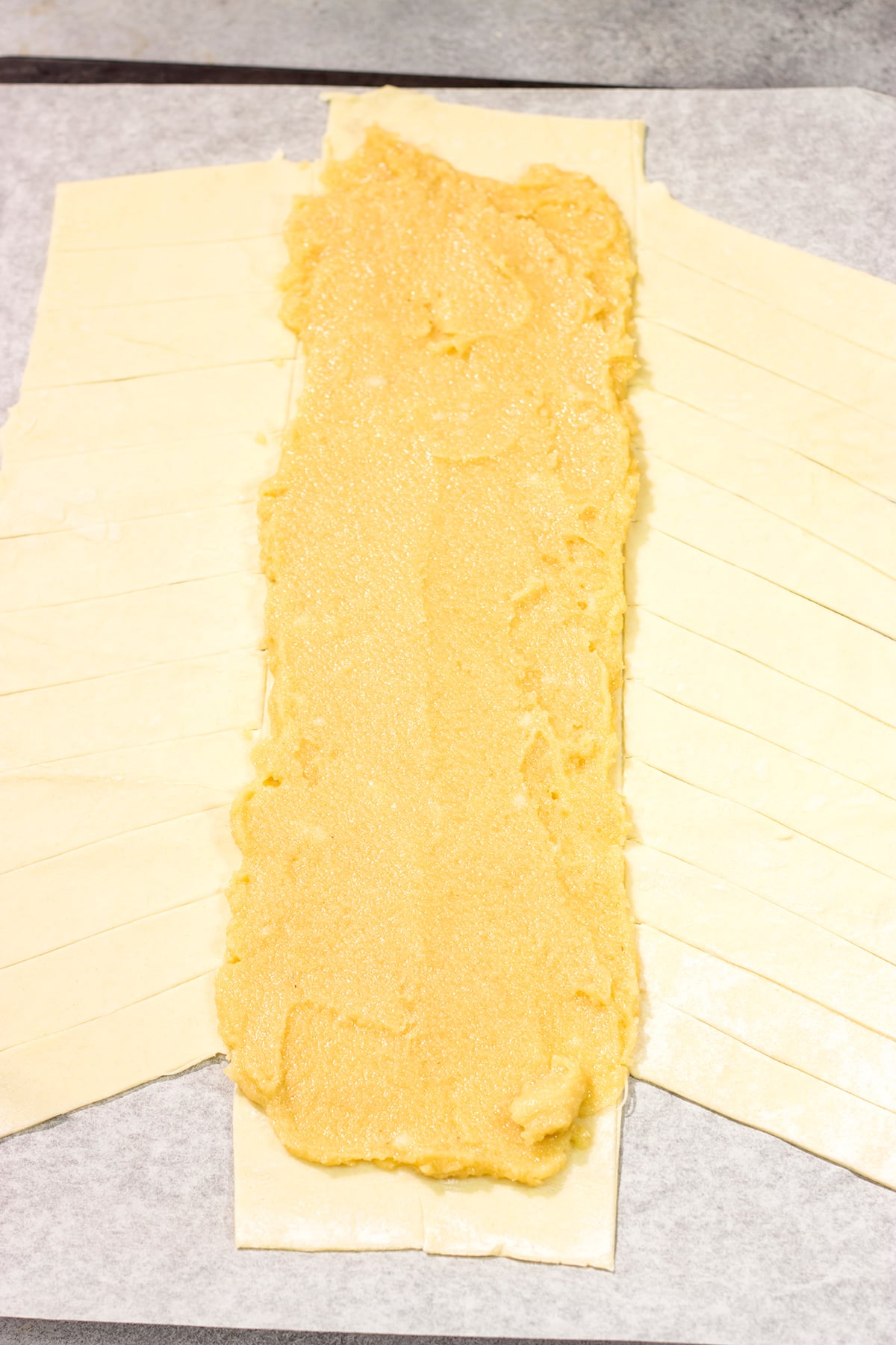 This Almond Puff Pastry recipe features flaky, buttery puff pastry wrapped around homemade almond paste. It's surprisingly easy to make - it'll become a family favorite!