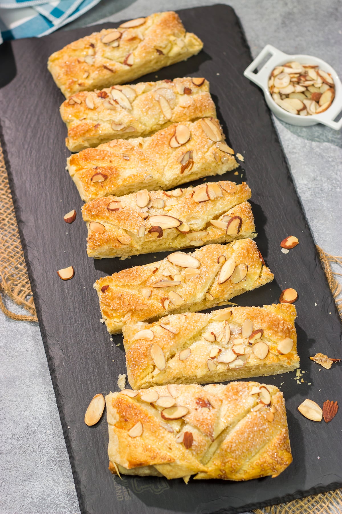 This Almond Puff Pastry recipe features flaky, buttery puff pastry wrapped around homemade almond paste. It's surprisingly easy to make - it'll become a family favorite!