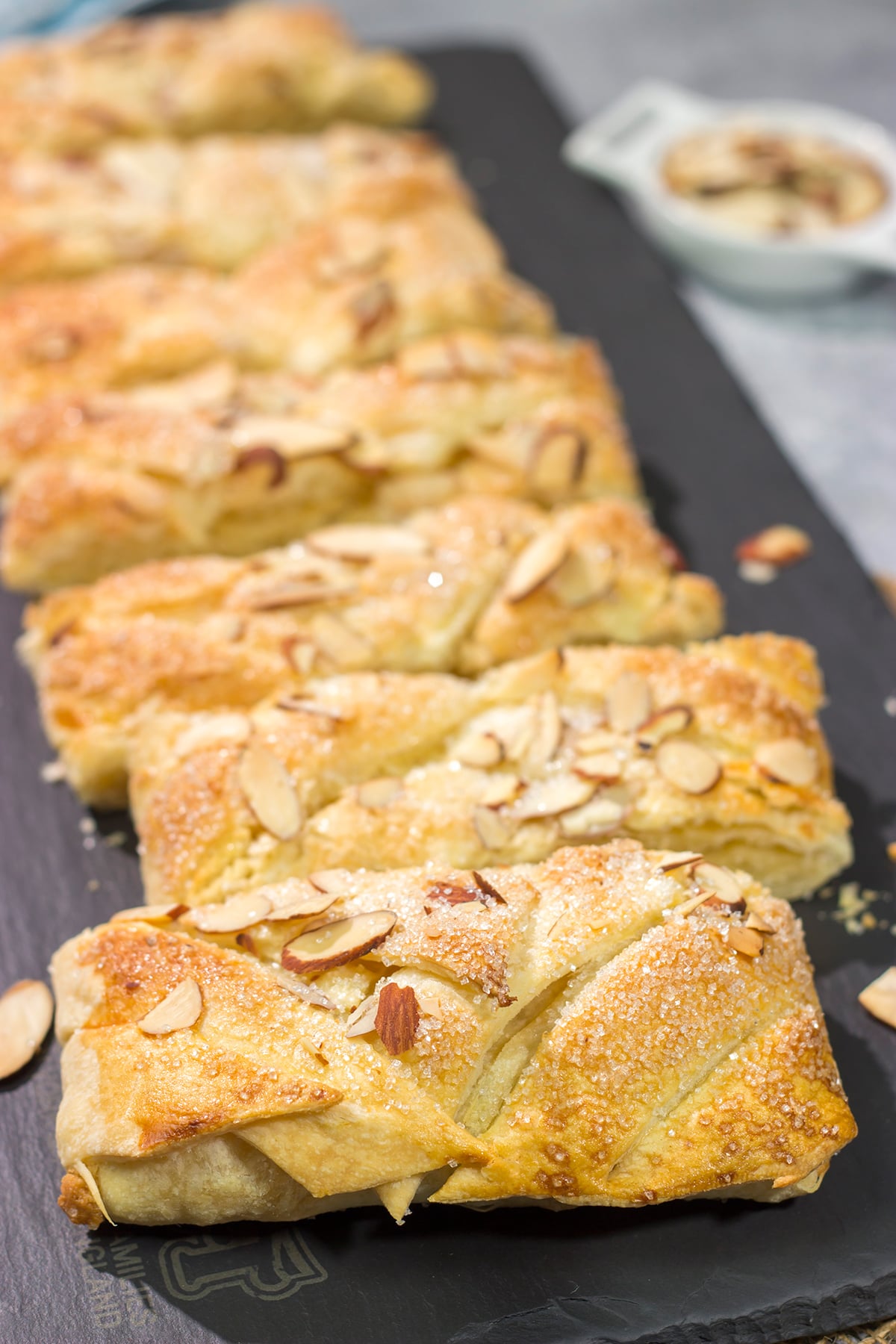 This Almond Puff Pastry recipe features flaky, buttery puff pastry wrapped around homemade almond paste. It's surprisingly easy to make - it'll become a family favorite!