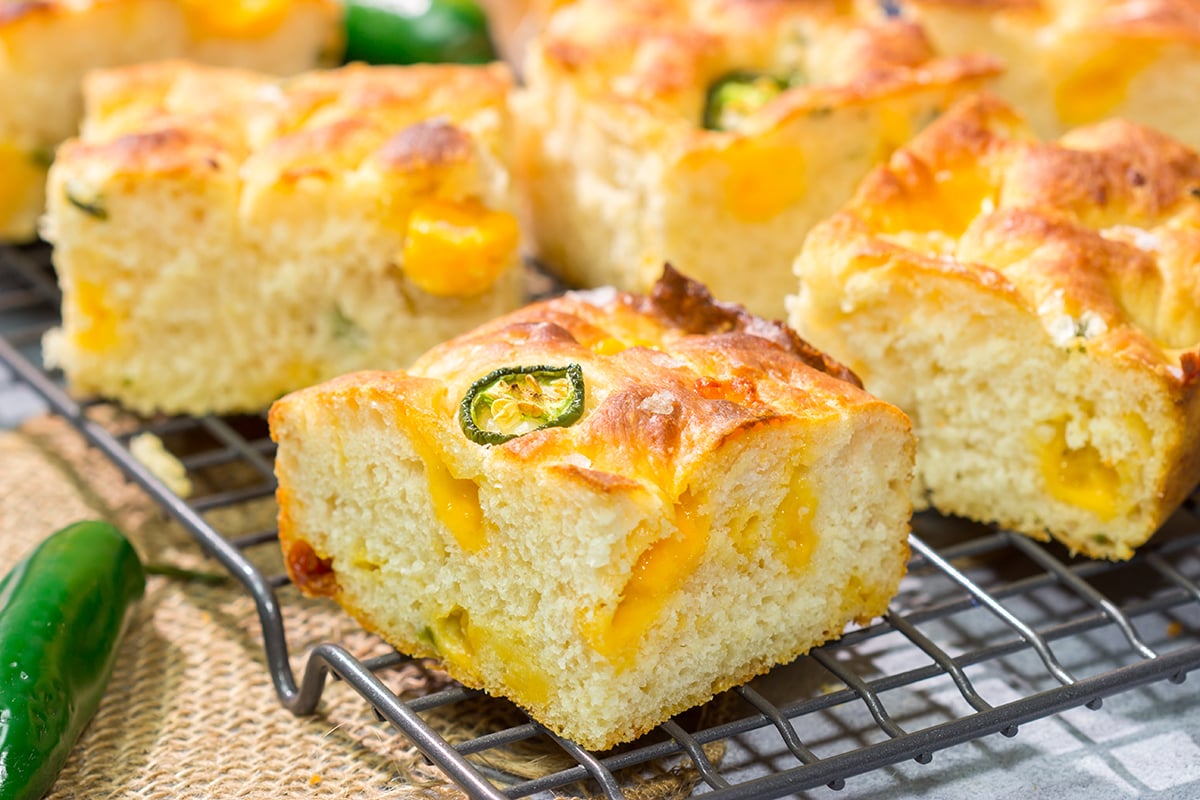 This Jalapeno Cheddar Focaccia features diced jalapenos and chunks of sharp cheddar cheese. It's fantastic next to soups and stews, or it can be sliced into sandwich bread. Grilled cheese sandwich, anyone??