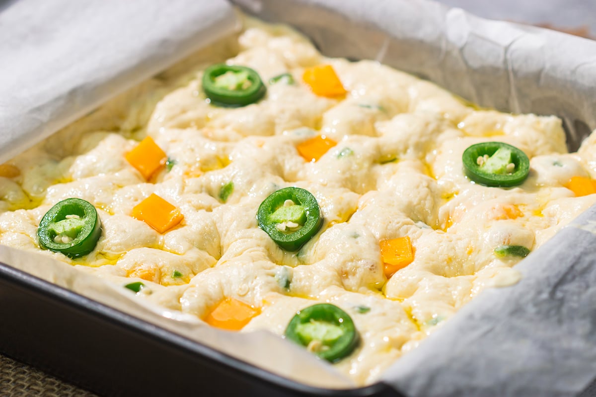 This Jalapeno Cheddar Focaccia features diced jalapenos and chunks of sharp cheddar cheese. It's fantastic next to soups and stews, or it can be sliced into sandwich bread. Grilled cheese sandwich, anyone??