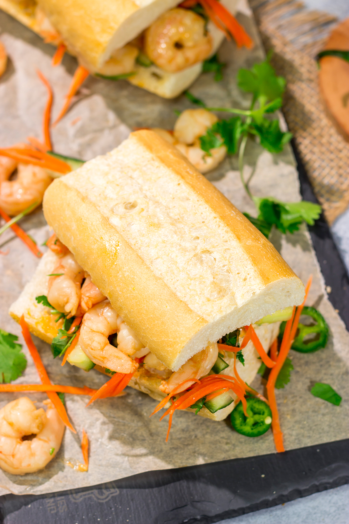 Shrimp Banh Mi is a classic Vietnamese street food...and it's surprisingly easy to make at home. Seasoned shrimp, tangy vegetables and fresh herbs combine to create a delicious sandwich!