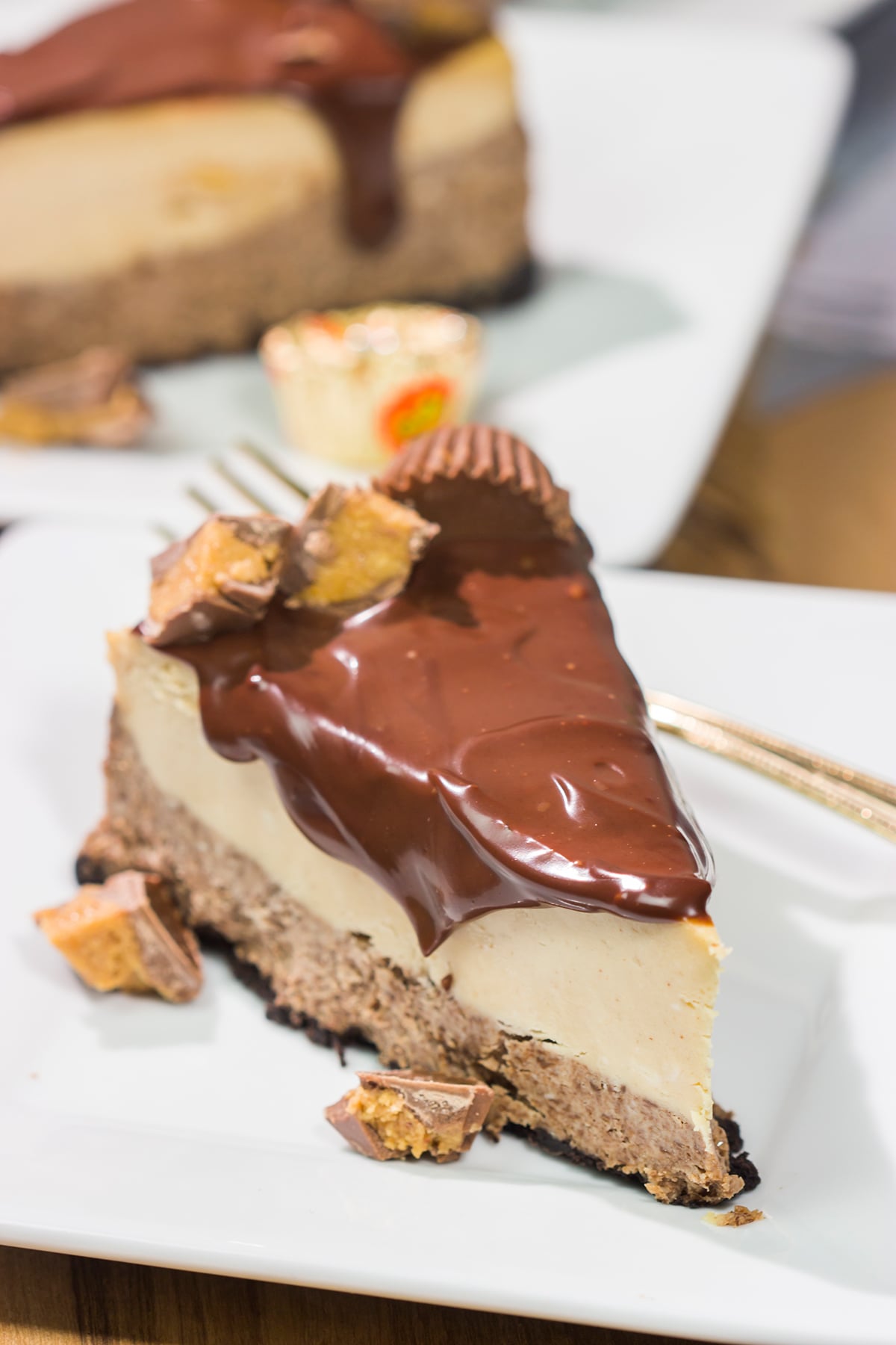 This Chocolate Peanut Butter Cheesecake features creamy layers of cheesecake topped with a decadent chocolate ganache. It's the ultimate chocolate lover's dessert!