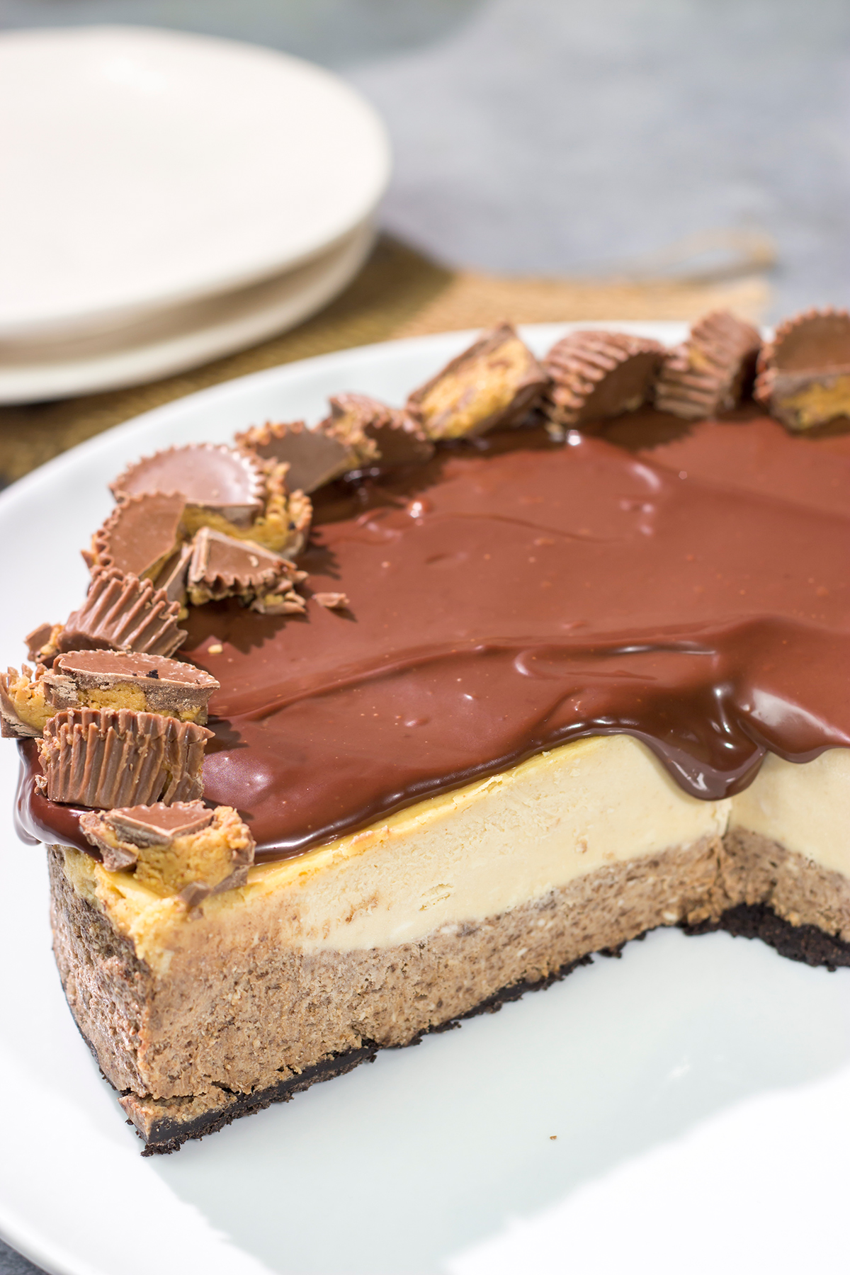 This Chocolate Peanut Butter Cheesecake features creamy layers of cheesecake topped with a decadent chocolate ganache. It's the ultimate chocolate lover's dessert!
