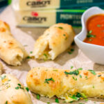 These Cheesy Stuffed Breadsticks are golden brown, buttery and stuffed with melted cheese - they're the ultimate comfort food appetizer or snack!