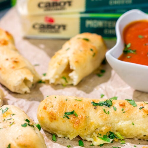 These Cheesy Stuffed Breadsticks are golden brown, buttery and stuffed with melted cheese - they're the ultimate comfort food appetizer or snack!