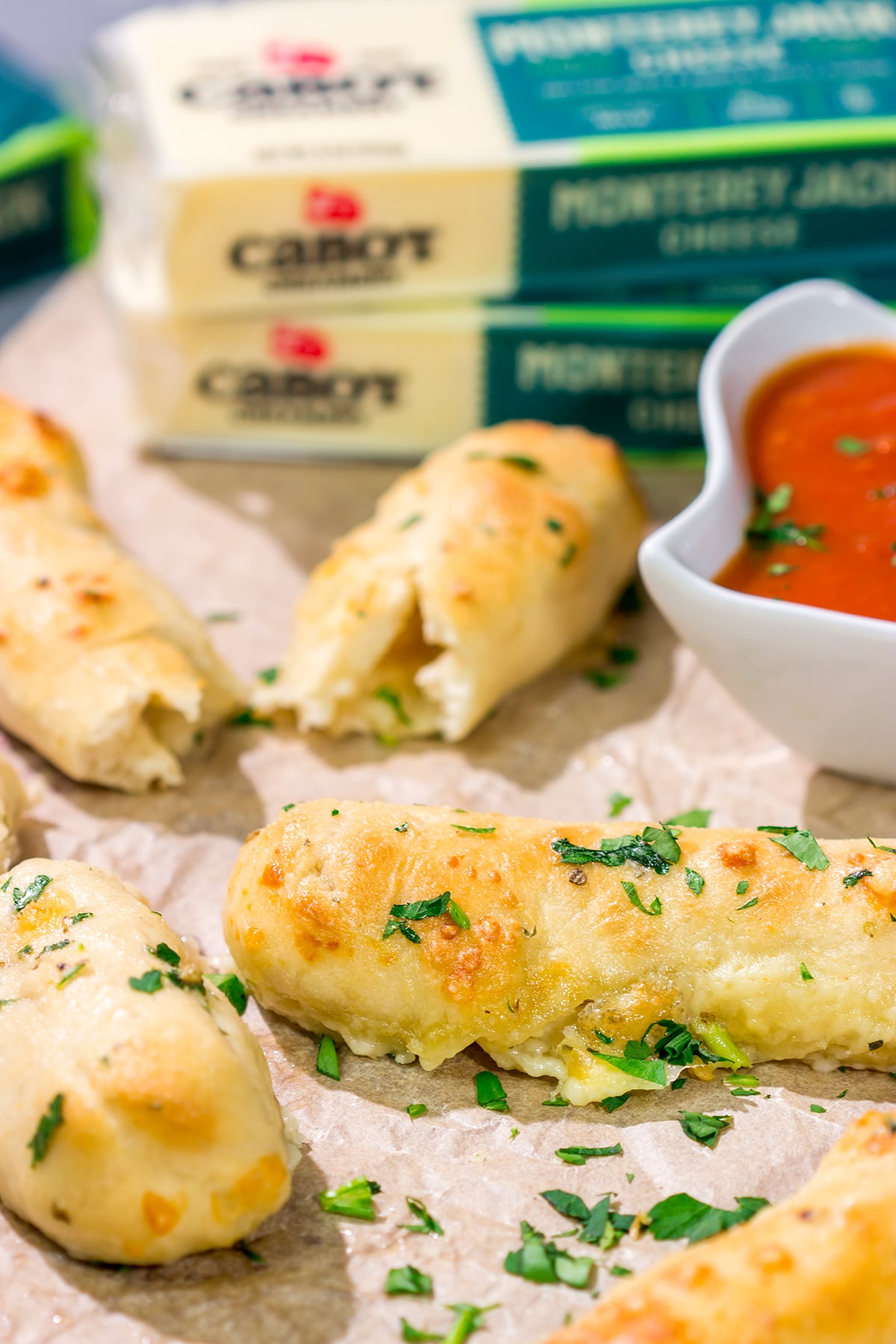 These Cheesy Stuffed Breadsticks are golden brown, buttery and stuffed with melted cheese - they're the ultimate comfort food appetizer or snack!