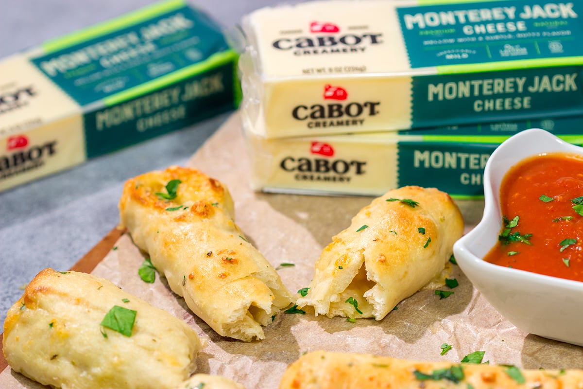 These Cheesy Stuffed Breadsticks are golden brown, buttery and stuffed with melted cheese - they're the ultimate comfort food appetizer or snack!