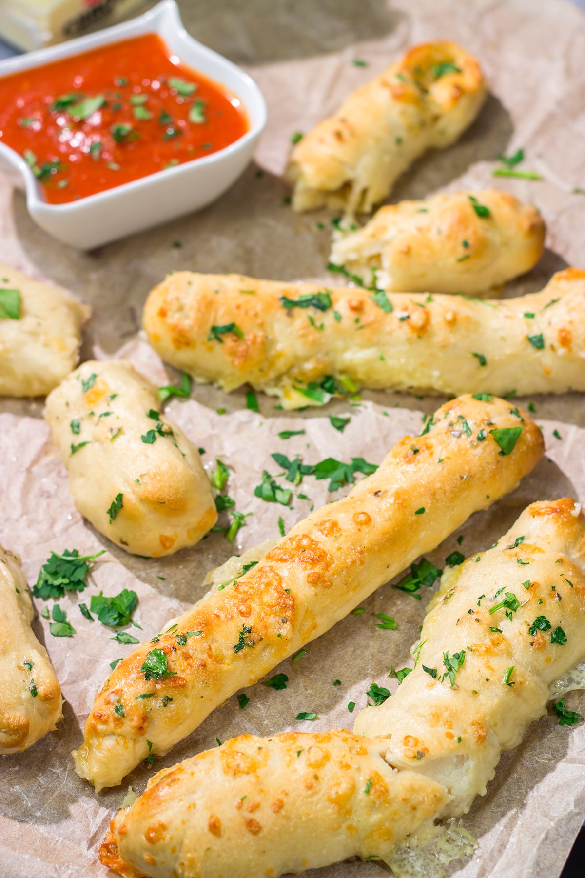 These Cheesy Stuffed Breadsticks are golden brown, buttery and stuffed with melted cheese - they're the ultimate comfort food appetizer or snack!