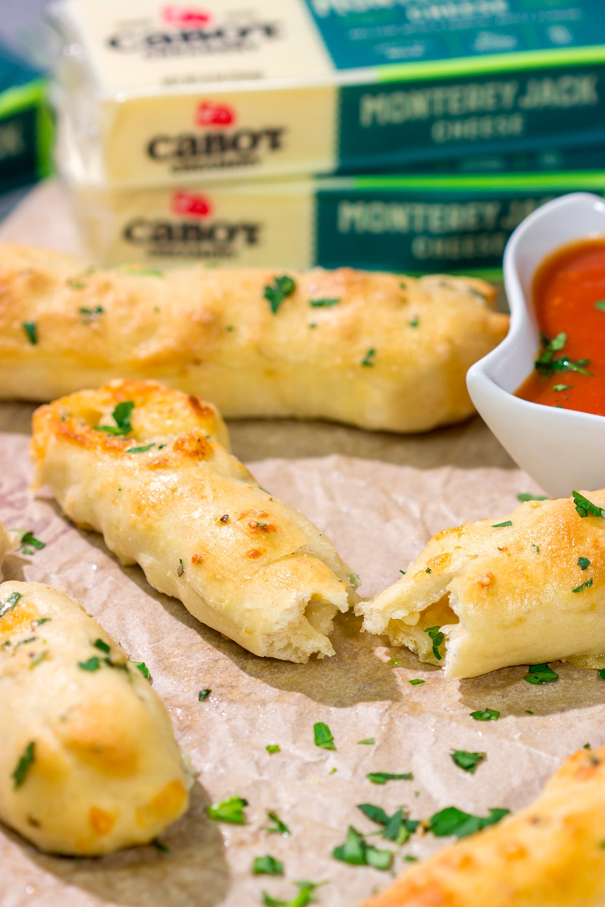 These Cheesy Stuffed Breadsticks are golden brown, buttery and stuffed with melted cheese - they're the ultimate comfort food appetizer or snack!