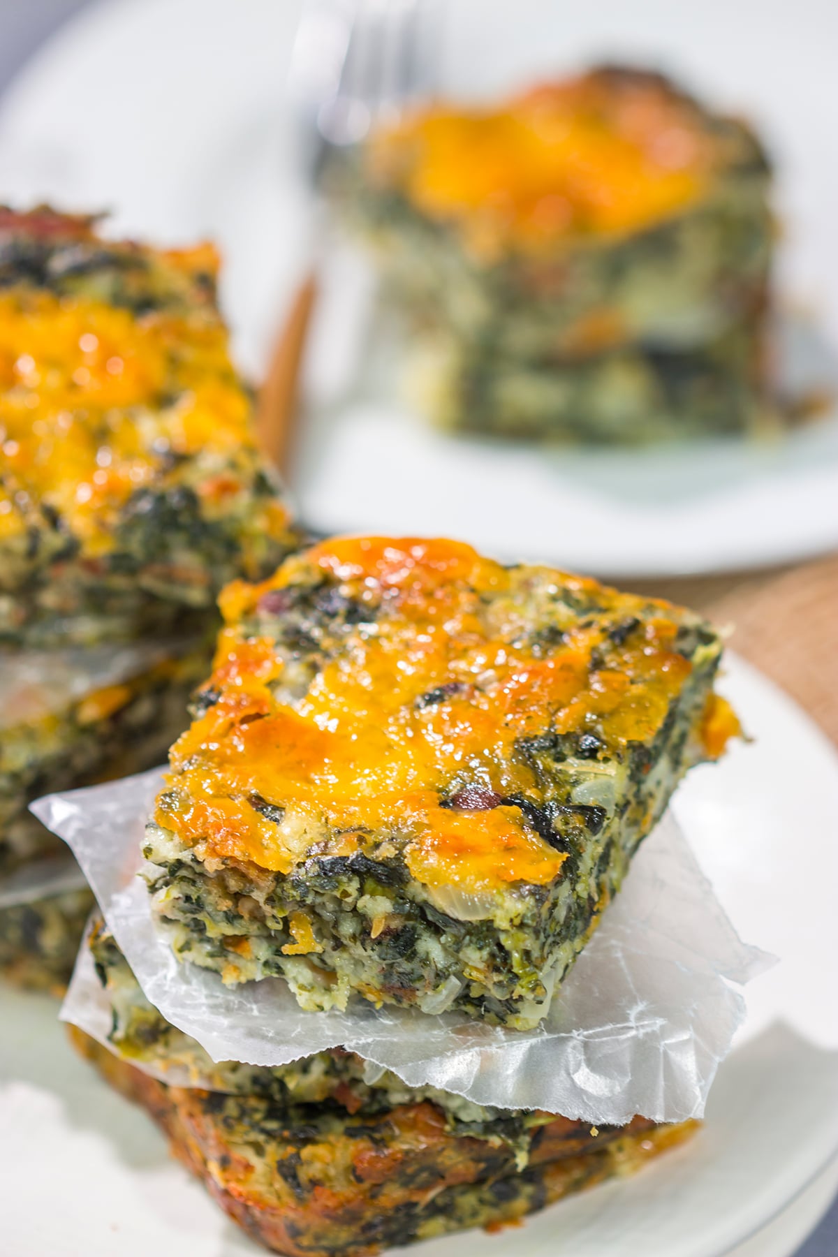 These baked Bacon Cheddar Spinach Squares are packed with flavor! They're easy to make, and they're perfect as a side dish or party appetizer.