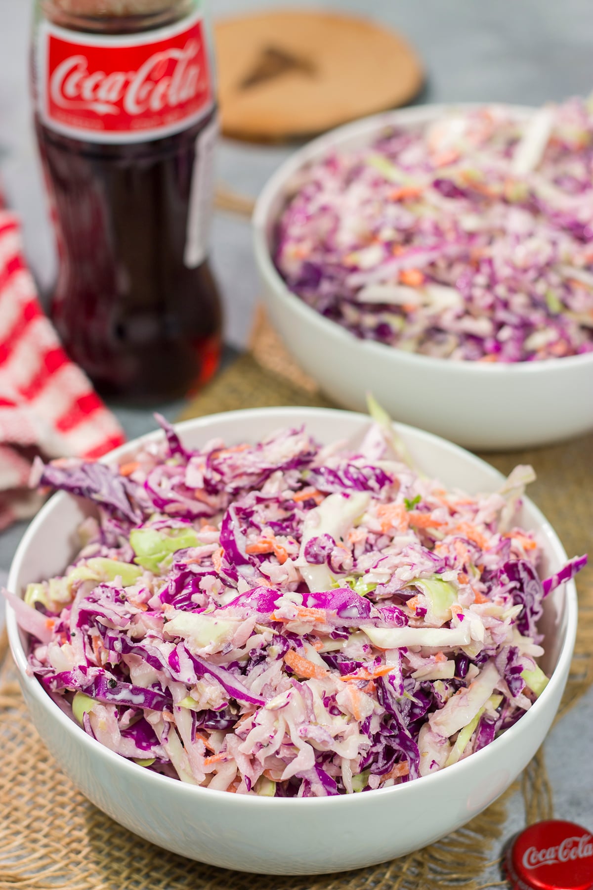 Add a fun twist to a classic coleslaw recipe with this Coca Cola Coleslaw. This classic slaw is flavorful and easy to make. It's perfect for summer picnics and BBQs!