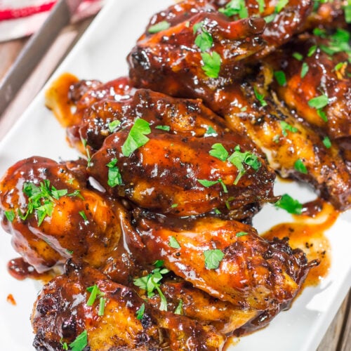 These Grilled BBQ Wings are slow cooked on the grill and brushed with barbecue sauce. They are the perfect summer party food!
