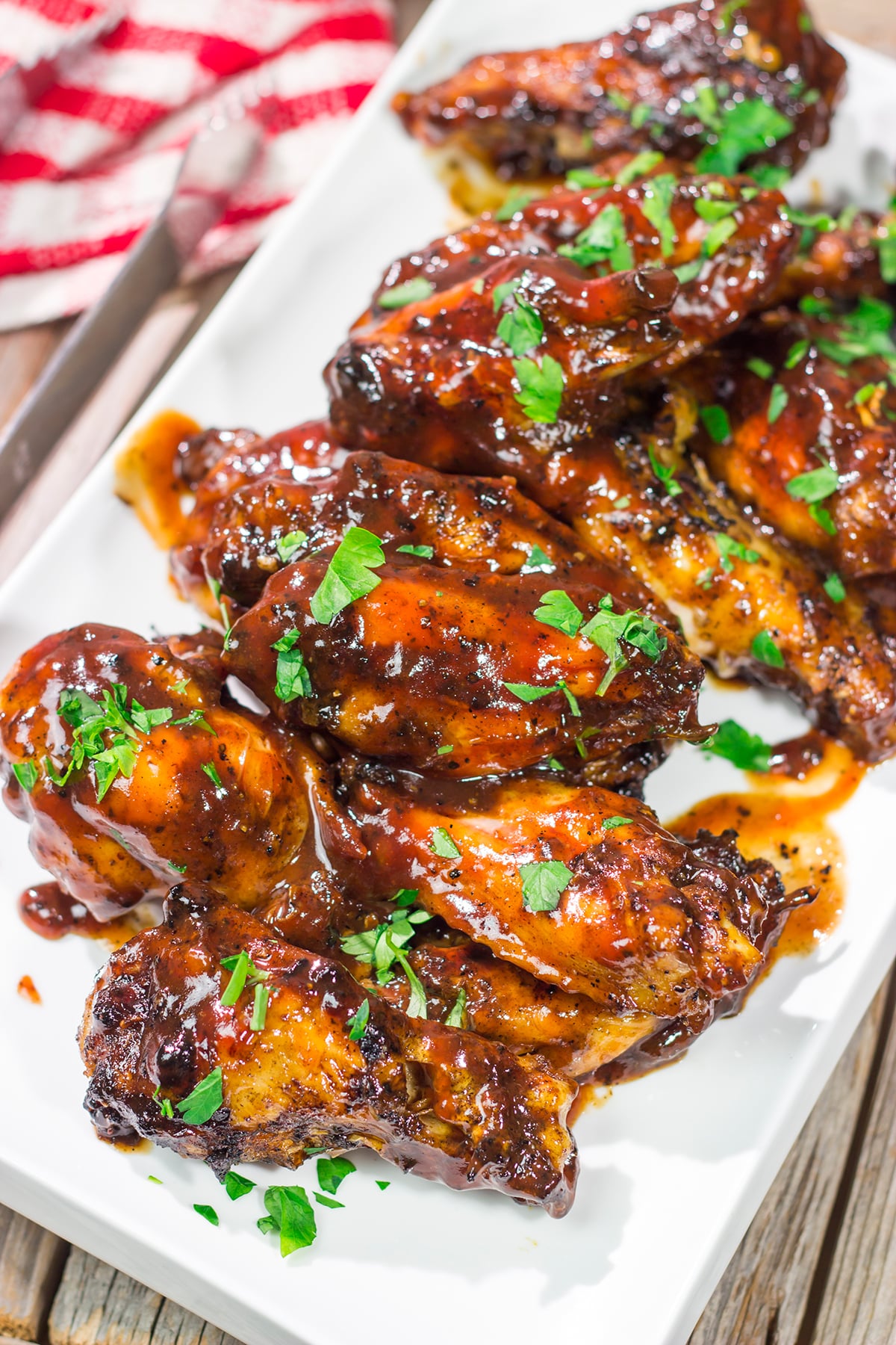 These Grilled BBQ Wings are slow cooked on the grill and brushed with barbecue sauce. They are the perfect summer party food!