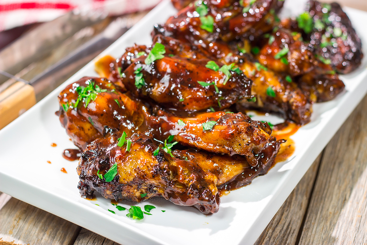 These Grilled BBQ Wings are slow cooked on the grill and brushed with barbecue sauce. They are the perfect summer party food!