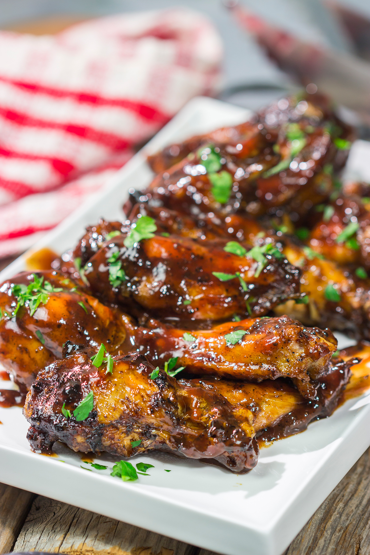 These Grilled BBQ Wings are slow cooked on the grill and brushed with barbecue sauce. They are the perfect summer party food!