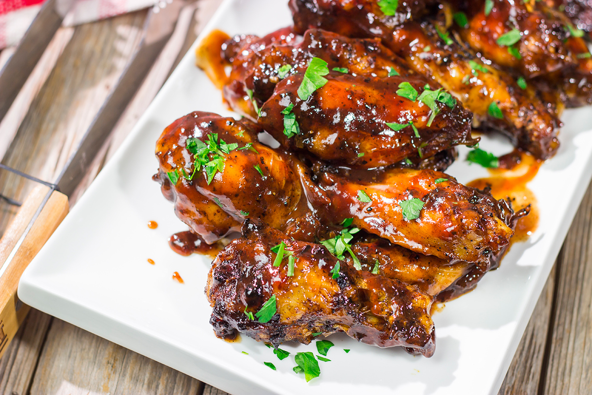 These Grilled BBQ Wings are slow cooked on the grill and brushed with barbecue sauce. They are the perfect summer party food!