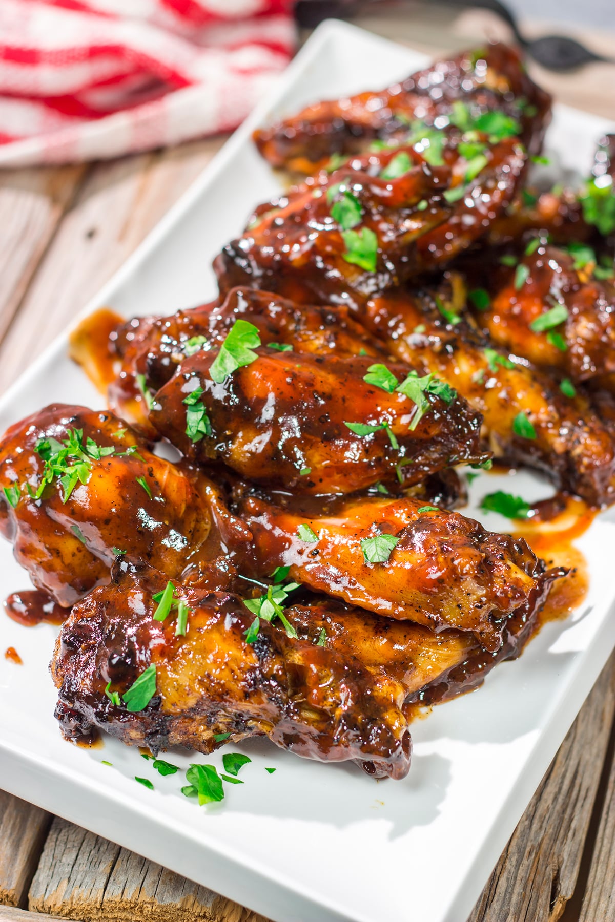 These Grilled BBQ Wings are slow cooked on the grill and brushed with barbecue sauce. They are the perfect summer party food!