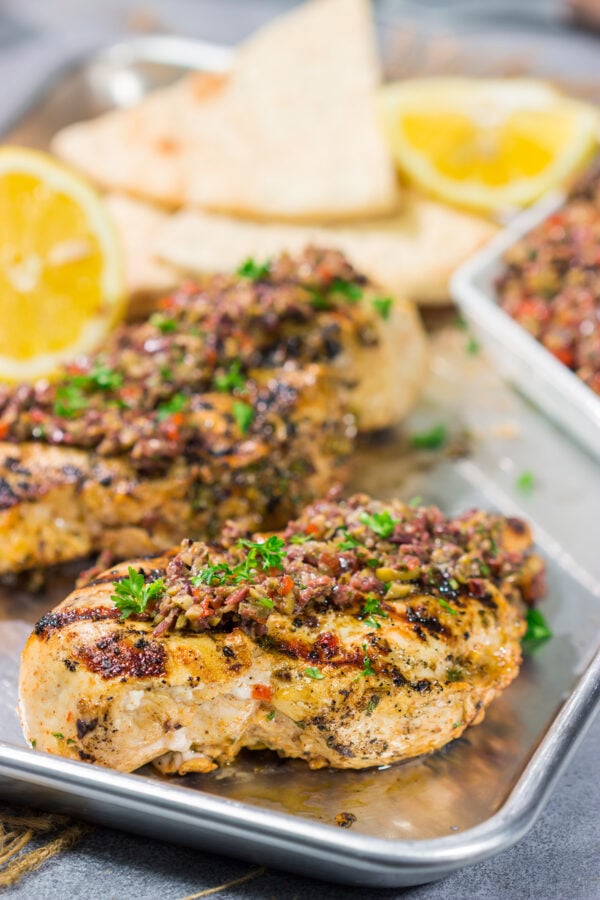 This Grilled Greek Chicken is tender and juicy...and packed with Mediterranean flavor! This easy recipe is perfect for summer grilling.