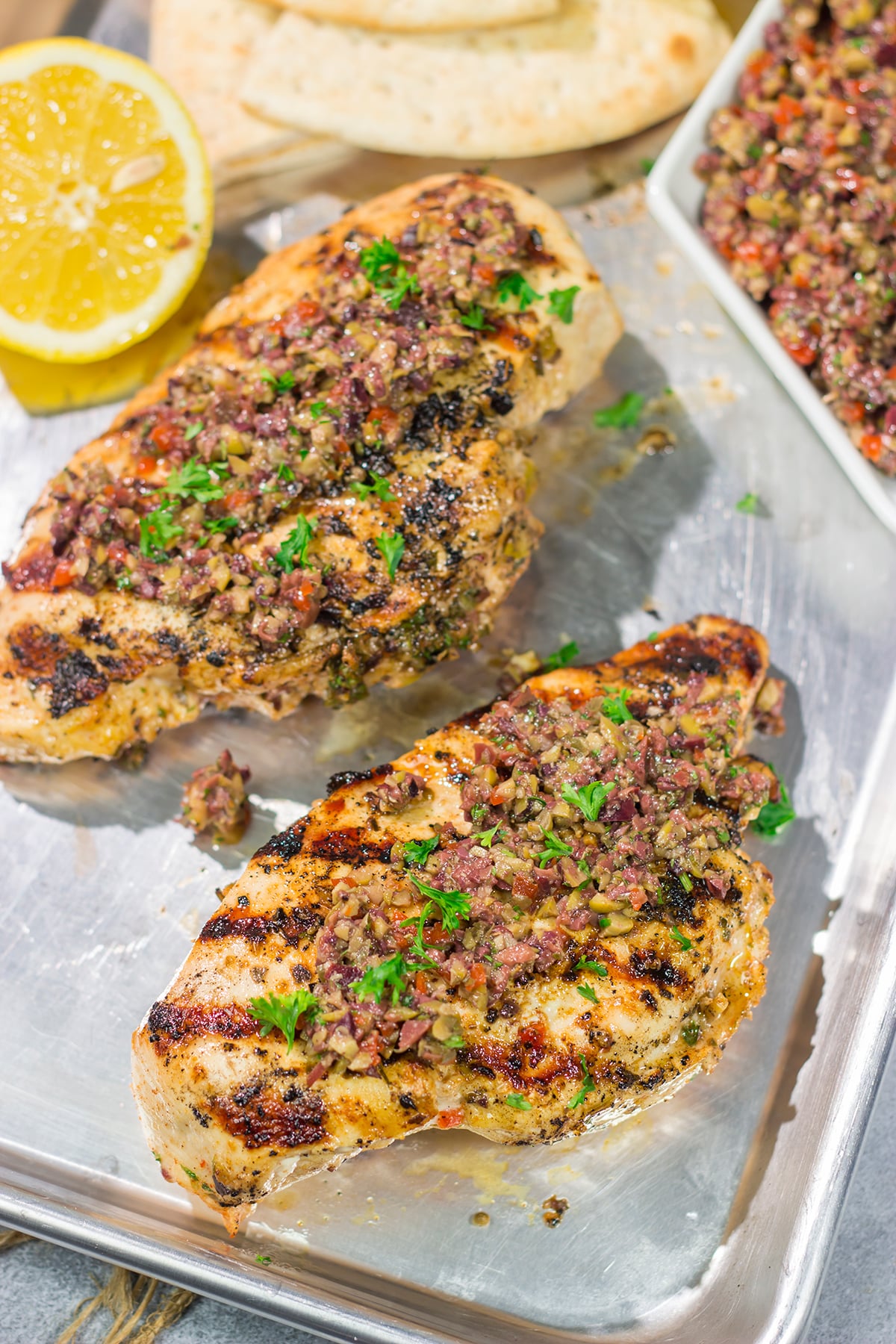 This Grilled Greek Chicken is tender and juicy...and packed with Mediterranean flavor! This easy recipe is perfect for summer grilling.