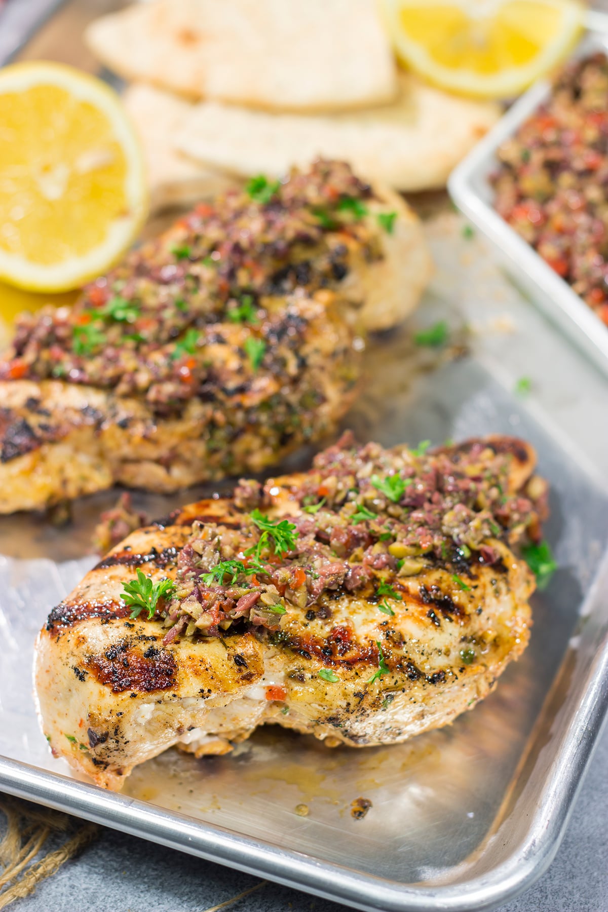 This Grilled Greek Chicken is tender and juicy...and packed with Mediterranean flavor! This easy recipe is perfect for summer grilling.