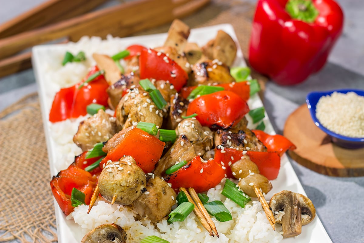 This delicious Grilled Yakitori Chicken recipe features juicy chicken brushed with a sweet and savory grilling sauce. It's the perfect way to mix up the summer grilling routine!