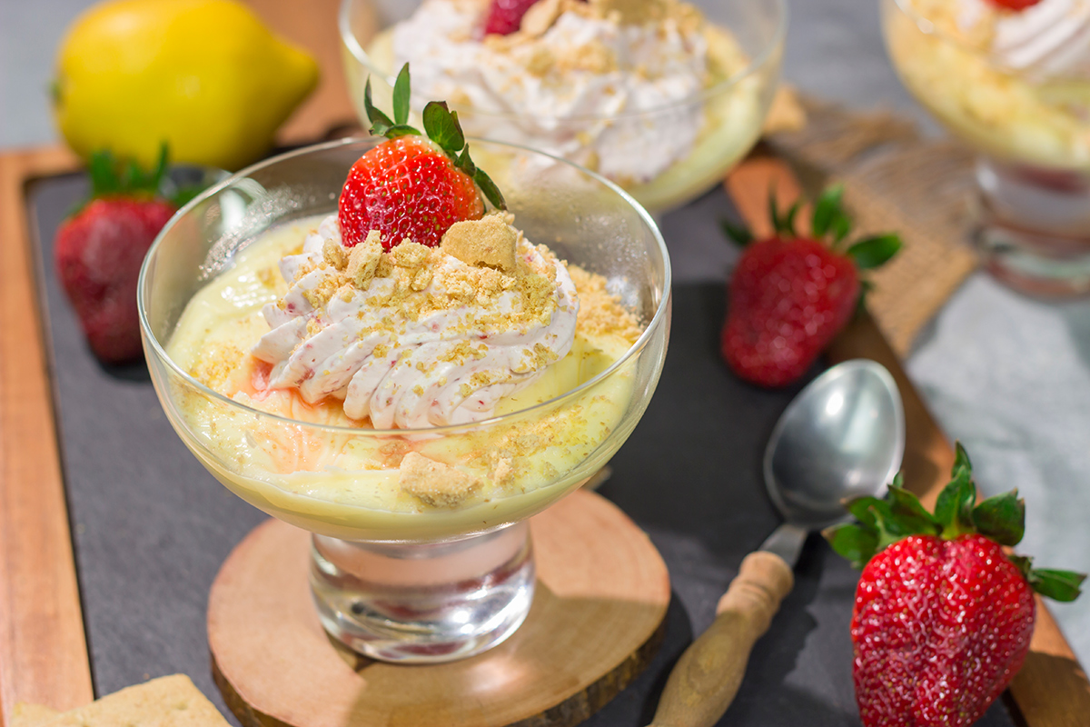 This Lemon Strawberry Pudding dessert features fresh, juicy strawberries layered with a mouthwatering lemon pudding. Oh, and don't forget the strawberry whipped cream on top!