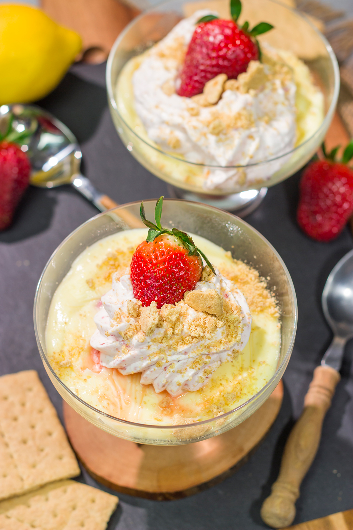 This Lemon Strawberry Pudding dessert features fresh, juicy strawberries layered with a mouthwatering lemon pudding. Oh, and don't forget the strawberry whipped cream on top!