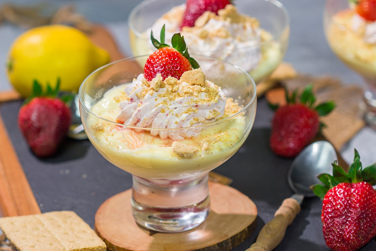 This Lemon Strawberry Pudding dessert features fresh, juicy strawberries layered with a mouthwatering lemon pudding. Oh, and don't forget the strawberry whipped cream on top!