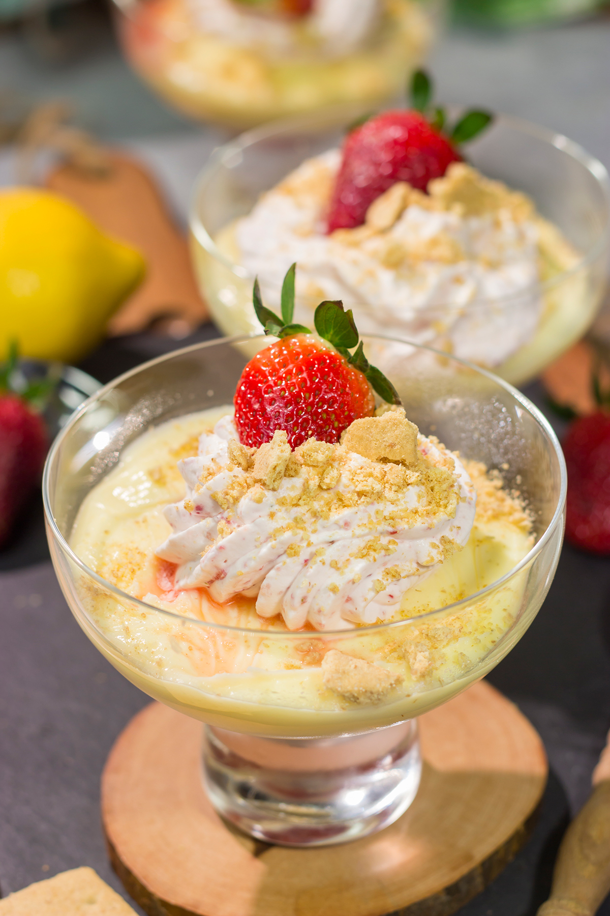This Lemon Strawberry Pudding dessert features fresh, juicy strawberries layered with a mouthwatering lemon pudding. Oh, and don't forget the strawberry whipped cream on top!