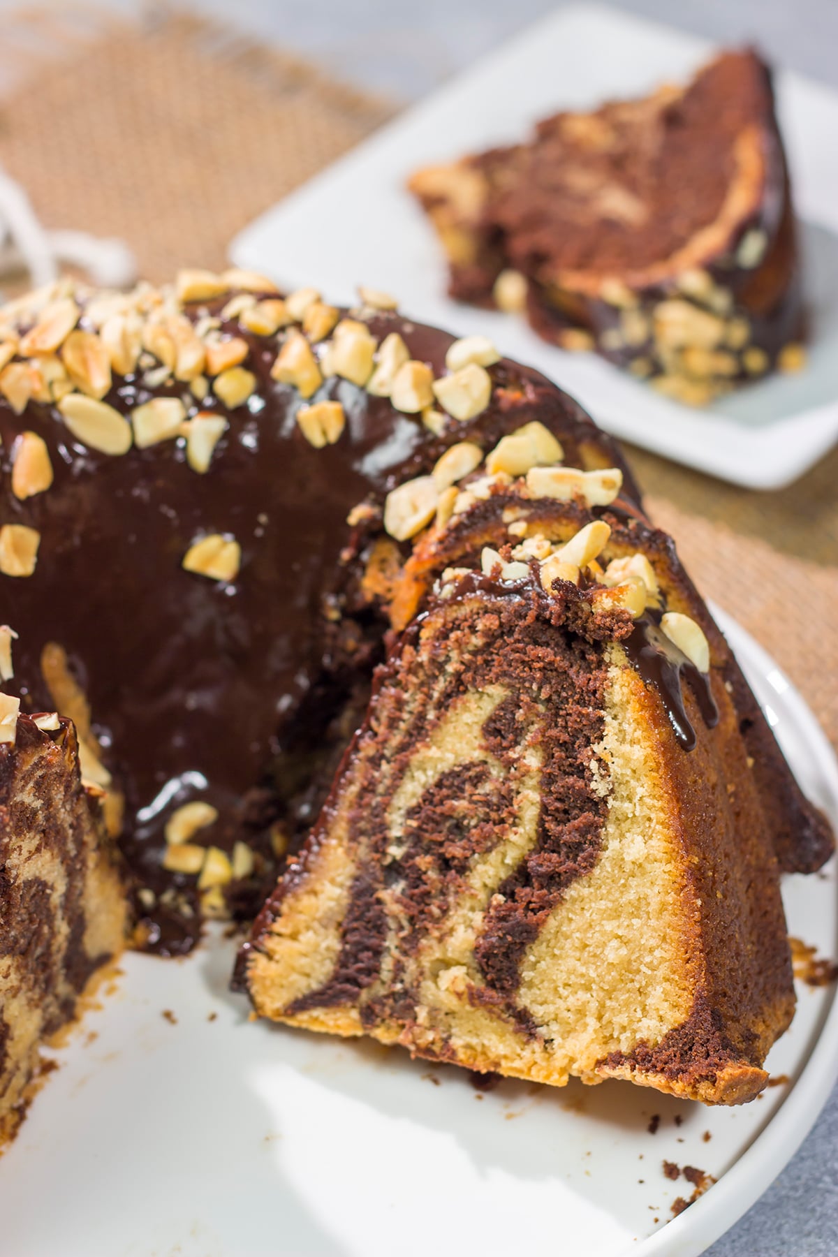 Featuring swirls of chocolate and peanut butter cake, this Chocolate Peanut Butter Pound Cake makes for a fun (and delicious) dessert recipe!