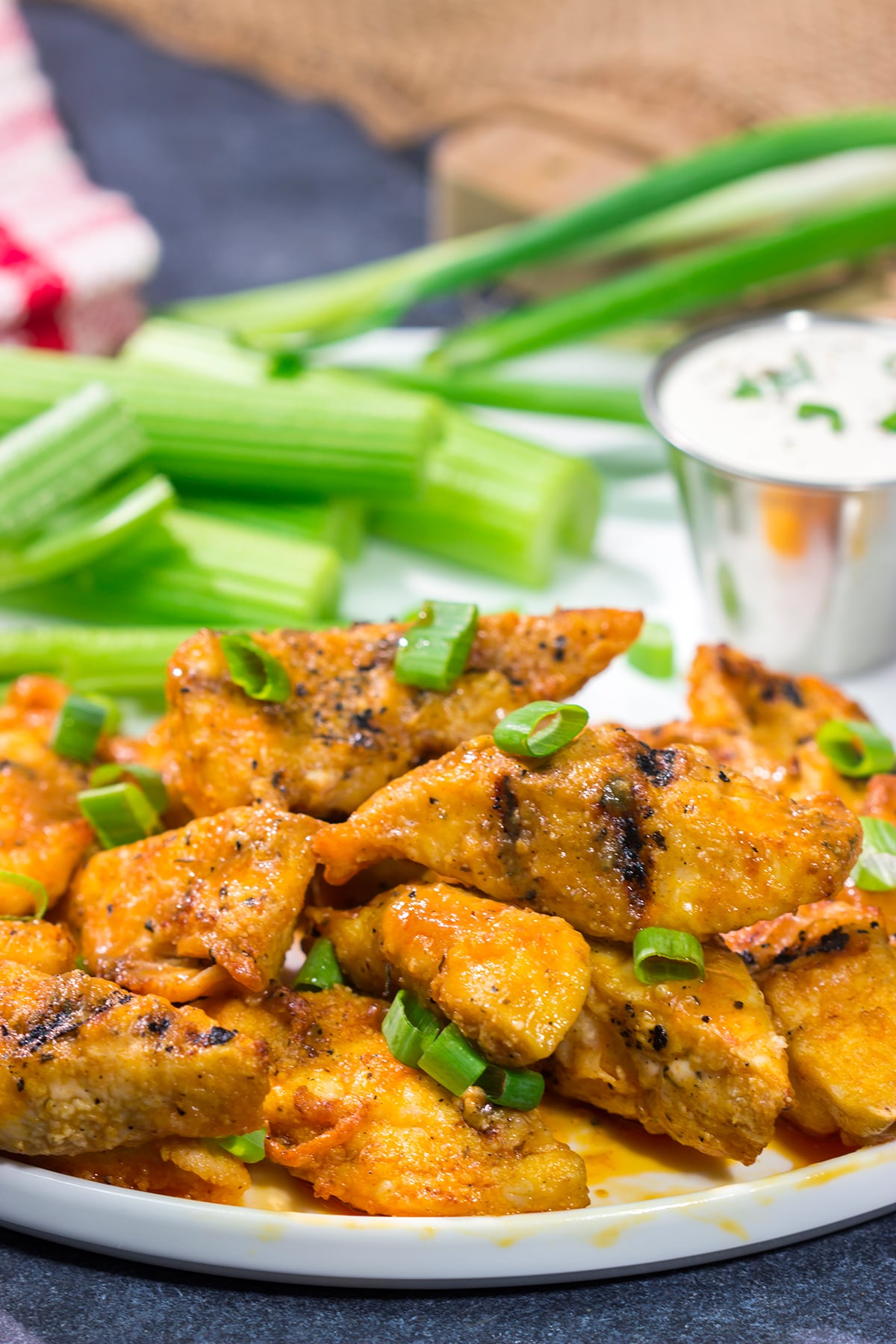 Fire up the grill! Tossed in a homemade buffalo sauce, these Grilled Boneless Buffalo Wings are a fun recipe for summer!