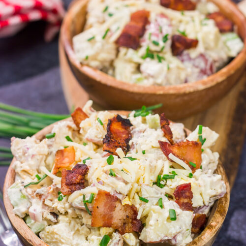 All of the toppings you love on a classic baked potato get combined in this Loaded Baked Potato Salad recipe. It's the perfect side dish for summer!