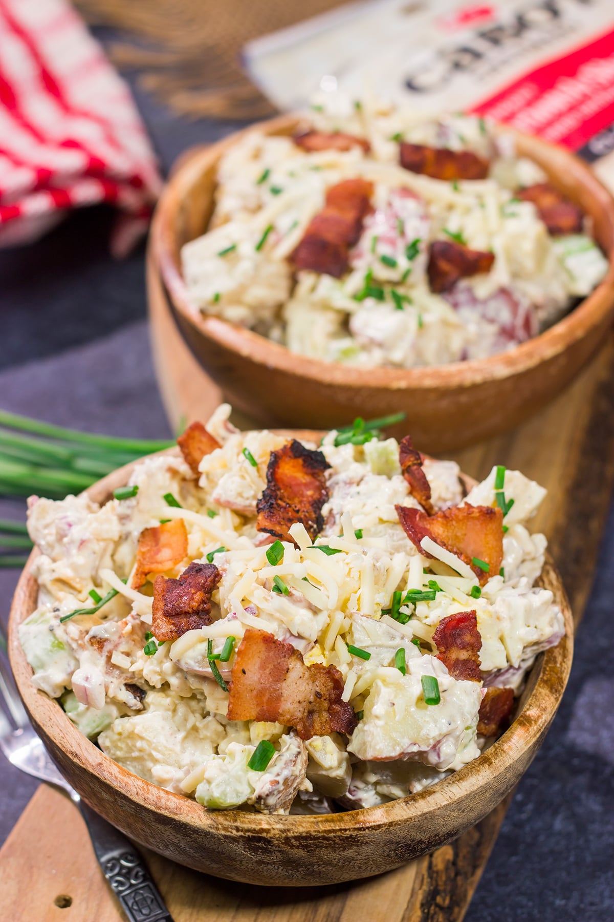 All of the toppings you love on a classic baked potato get combined in this Loaded Baked Potato Salad recipe. It's the perfect side dish for summer!