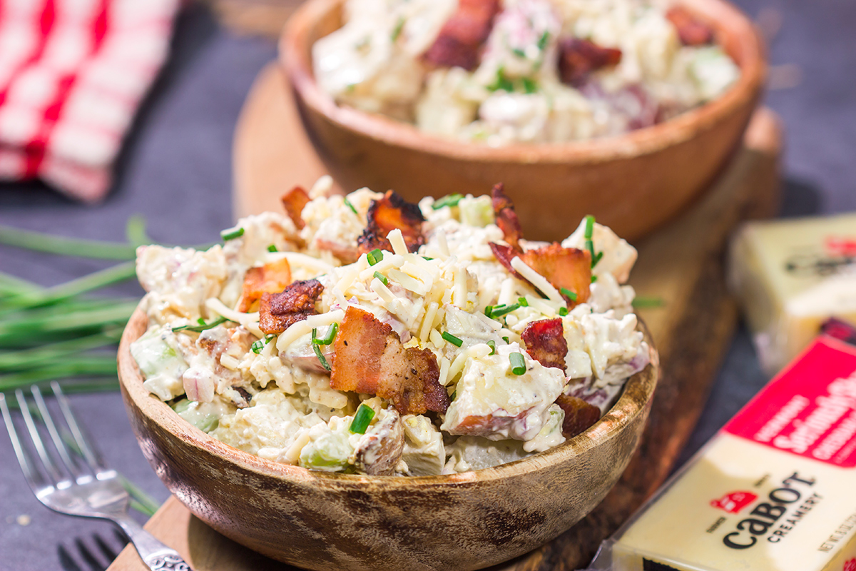 All of the toppings you love on a classic baked potato get combined in this Loaded Baked Potato Salad recipe. It's the perfect side dish for summer!