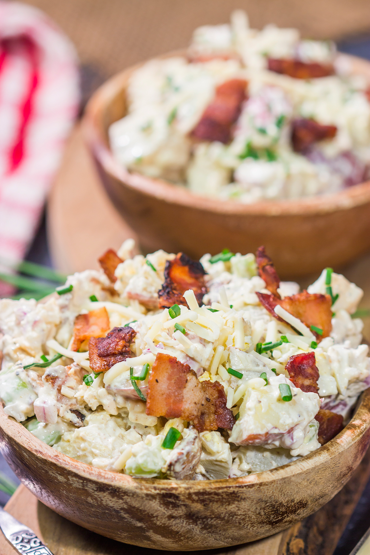 All of the toppings you love on a classic baked potato get combined in this Loaded Baked Potato Salad recipe. It's the perfect side dish for summer!