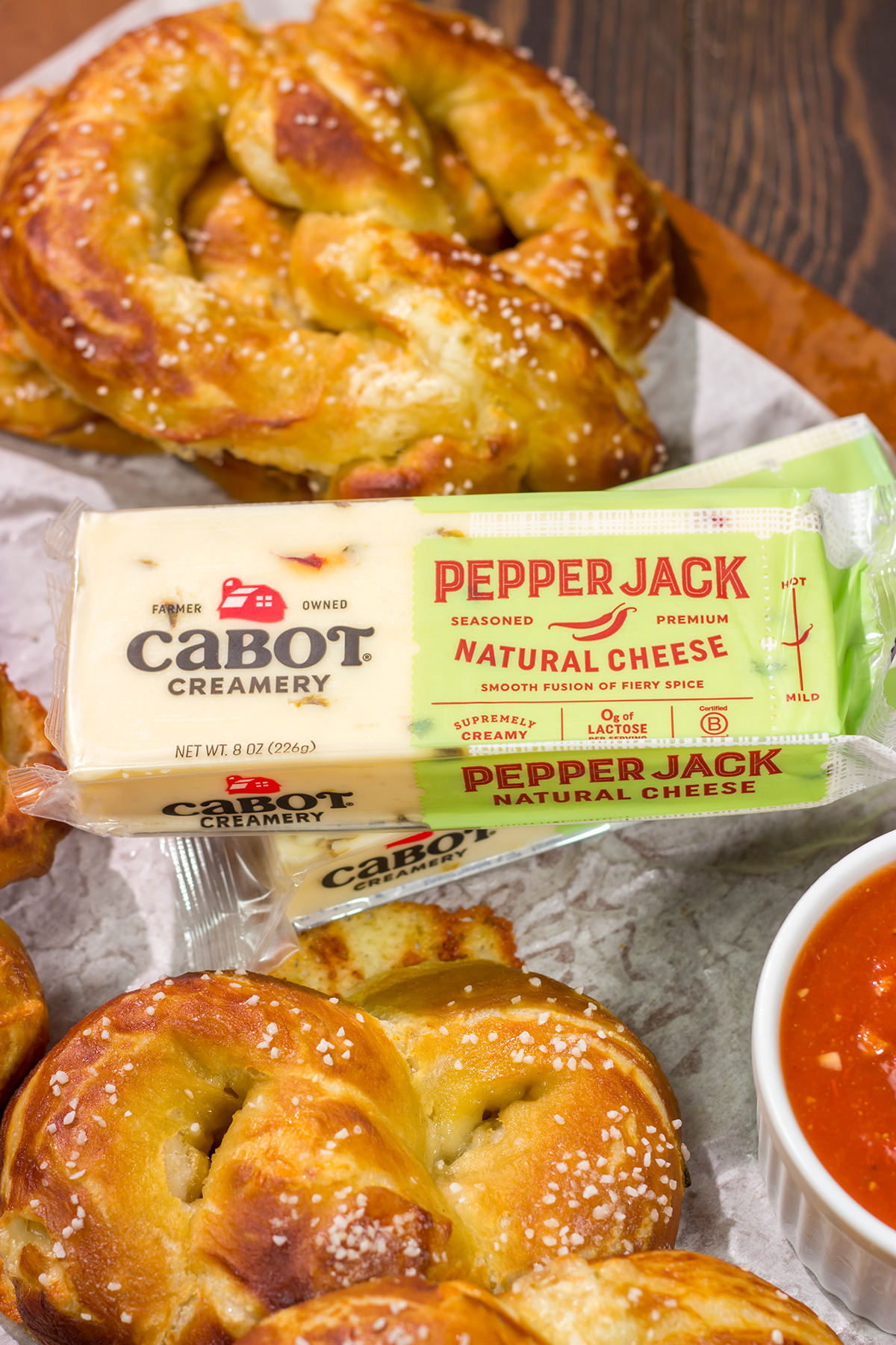 These Cheesy Soft Pretzels are stuffed with melty cheese for the ultimate gameday snack. These warm, golden brown pretzels are absolutely irresistible!