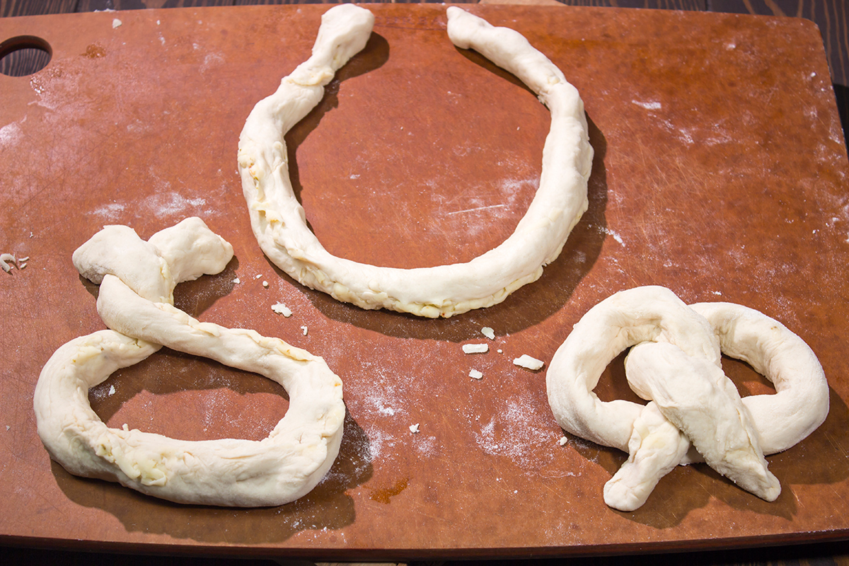 These Cheesy Soft Pretzels are stuffed with melty cheese for the ultimate gameday snack. These warm, golden brown pretzels are absolutely irresistible!